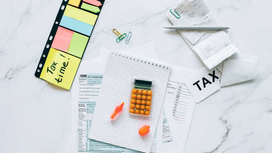 Tax Time with paperwork around a calculator